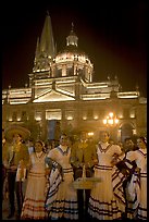 Men and women in traditional mexican costume with Cathedral in background. Guadalajara, Jalisco, Mexico