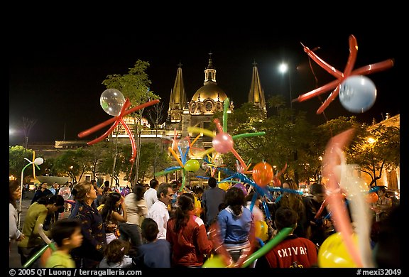 Children playing with ballons on Plaza de la Liberacion by night. Guadalajara, Jalisco, Mexico