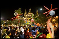 Children playing with ballons on Plaza de la Liberacion by night. Guadalajara, Jalisco, Mexico