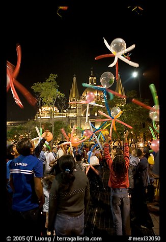 Children playing with ballons behind the Cathedral on  Plaza de la Liberacion. Guadalajara, Jalisco, Mexico