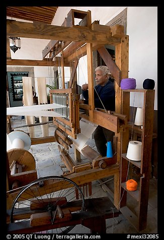 Traditional weaver and machine seen from the side, Tlaquepaque. Jalisco, Mexico (color)