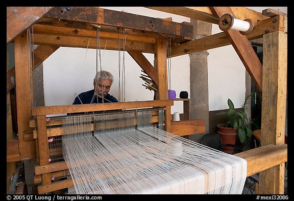 Weaver operating a traditional machine, Tlaquepaque. Jalisco, Mexico