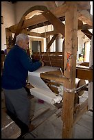 Traditional weaver and machine seen from the back, Tlaquepaque. Jalisco, Mexico