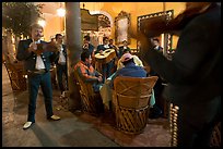 Mariachi musicians performing a serenade at the Parian, Tlaquepaque. Jalisco, Mexico ( color)