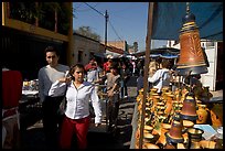 People strolling iin the sunday town-wide arts and crafts market, Tonala. Jalisco, Mexico