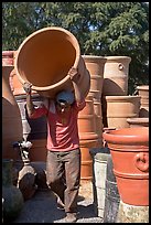 Man carrying a heavy pot, Tonala. Jalisco, Mexico (color)