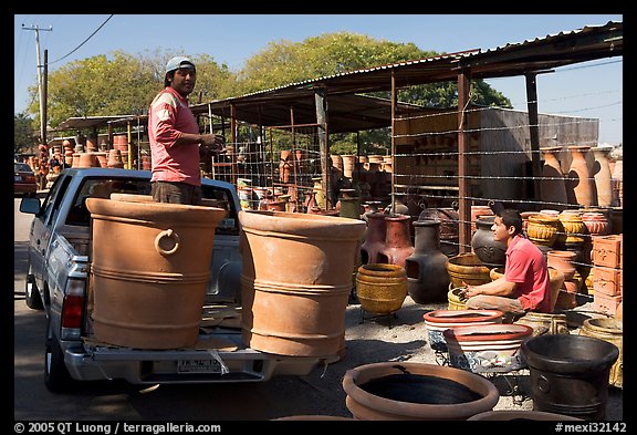 Pots being loaded on the back of a pick-up truck, Tonala. Jalisco, Mexico (color)