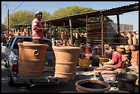 Pots being loaded on the back of a pick-up truck, Tonala. Jalisco, Mexico