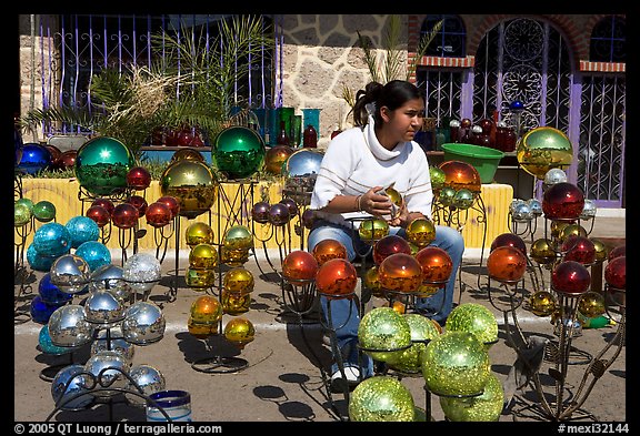 Woman polishing glass spheres, Tonala. Jalisco, Mexico (color)