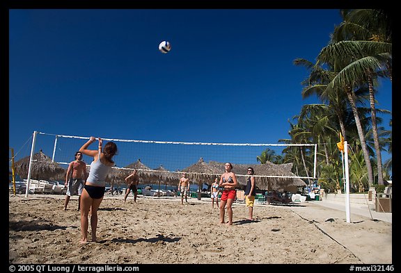 Vacationers playing beach volley-ball, Nuevo Vallarta, Nayarit. Jalisco, Mexico (color)