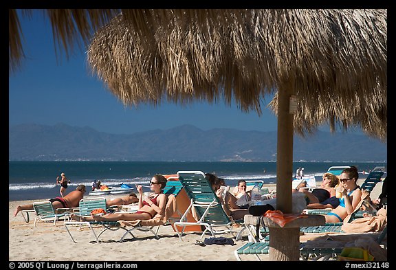 People lying on beach chairs, Nuevo Vallarta, Nayarit. Jalisco, Mexico (color)