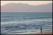Woman holding children on the beach at sunset, Nuevo Vallarta, Nayarit. Jalisco, Mexico (color)