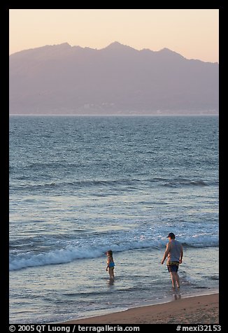Man and child on the beach at sunset, Nuevo Vallarta, Nayarit. Jalisco, Mexico (color)