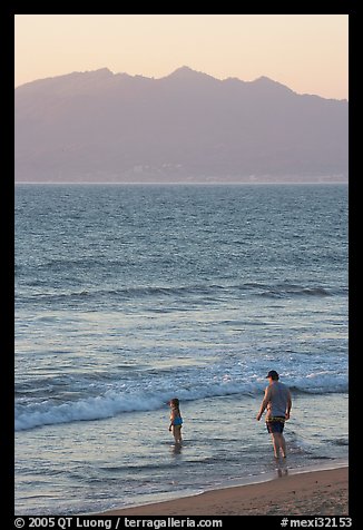 Man and child on the beach at sunset, Nuevo Vallarta, Nayarit. Jalisco, Mexico