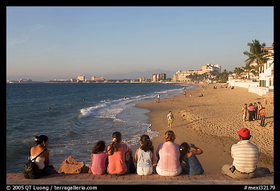 Family sitting above the beach, late afternoon, Puerto Vallarta, Jalisco. Jalisco, Mexico (color)