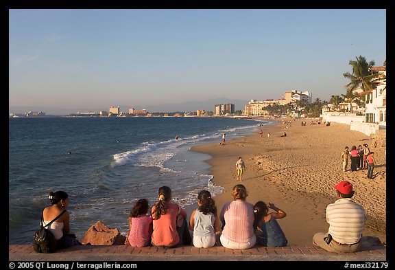 Family sitting above the beach, late afternoon, Puerto Vallarta, Jalisco. Jalisco, Mexico