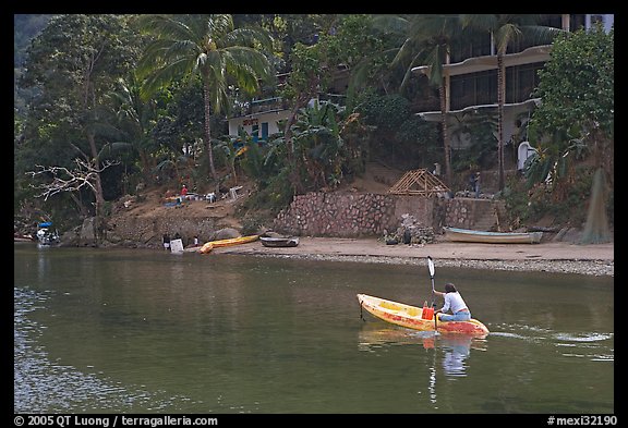 Woman using a canoe in a village,  Boca de Tomatlan, Jalisco. Jalisco, Mexico