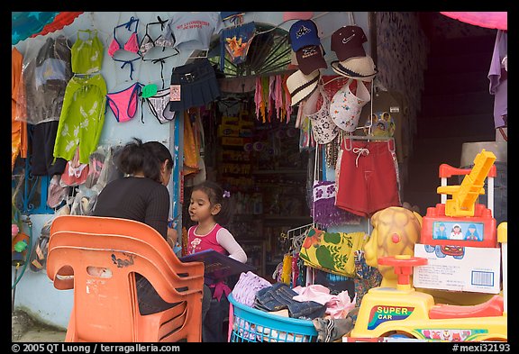 Woman and girl outside a store,  Boca de Tomatlan, Jalisco. Jalisco, Mexico (color)