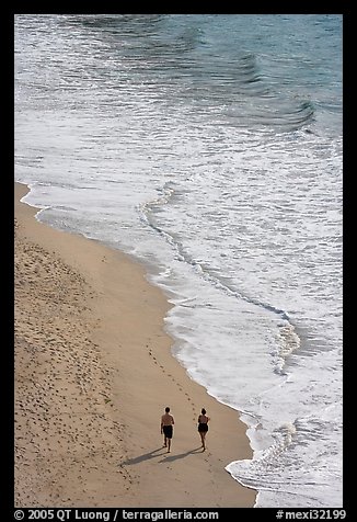 Couple walking on the beach seen from above, Puerto Vallarta, Jalisco. Jalisco, Mexico