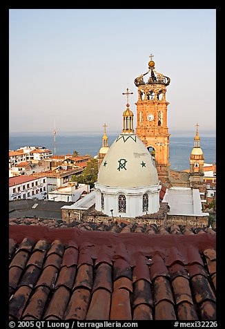 Red tile roof, Templo de Guadalupe Cathedral, and ocean early morning, Puerto Vallarta, Jalisco. Jalisco, Mexico