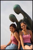 Women sitting on the sculpture called Nostalgia, Puerto Vallarta, Jalisco. Jalisco, Mexico ( color)