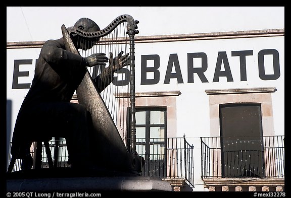 Statue of a musician and house with inscriptions. Zacatecas, Mexico