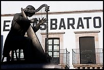 Statue of a musician and house with inscriptions. Zacatecas, Mexico