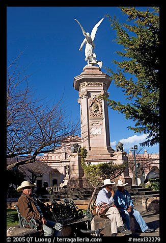 Men wearing cow-boy hats sitting in Garden of Independencia. Zacatecas, Mexico