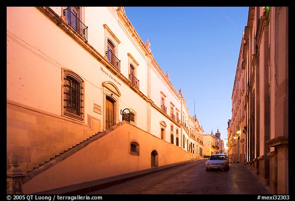 Car in street at dawn with Zacatecas Museum. Zacatecas, Mexico (color)