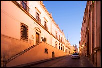 Car in street at dawn with Zacatecas Museum. Zacatecas, Mexico