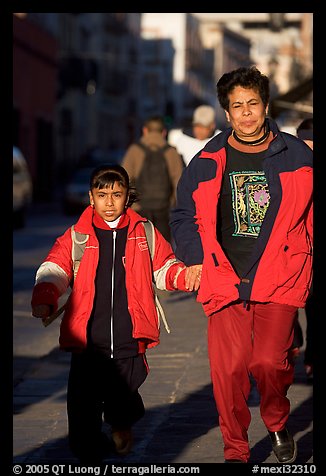 Mother and daughter on a sidewalk. Zacatecas, Mexico