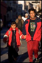 Mother and daughter on a sidewalk. Zacatecas, Mexico