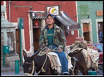 Young man riding a donkey in the streets. Guanajuato, Mexico ( color)