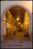 Man walking in an arched passage a dawn. Guanajuato, Mexico ( color)