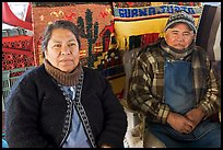 Couple sitting in front of carpets. Guanajuato, Mexico ( color)