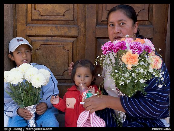 Woman with two children sitting in doorway. Guanajuato, Mexico