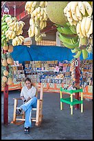 Woman sitting in a fruit stand. Mexico