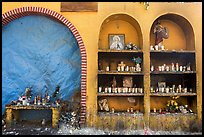 The exterior wall of a roadside chapel. Mexico