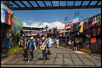 Musicians walking in flee market, La Bufadora. Baja California, Mexico (color)