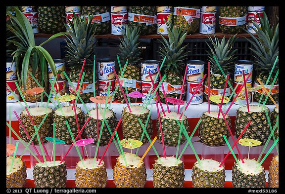 Pinacoladas prepared in pineapple shells. Baja California, Mexico (color)