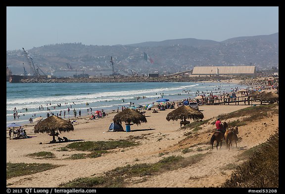 Beach with shade palapas and horseman, Ensenada. Baja California, Mexico (color)