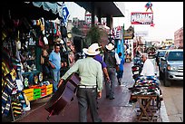 Musicians walking on street, Ensenada. Baja California, Mexico (color)