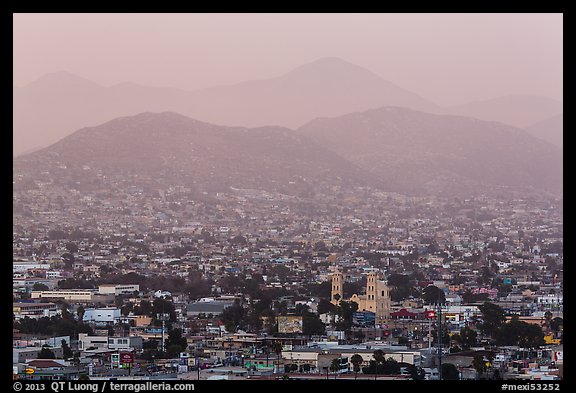 Distant view of Ensendada spreading up hills at sunset. Baja California, Mexico (color)