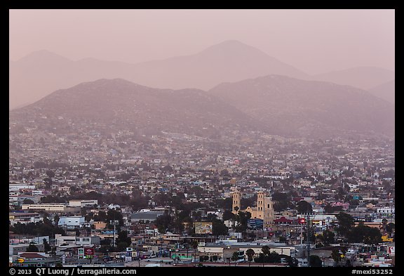 Distant view of Ensendada spreading up hills at sunset. Baja California, Mexico