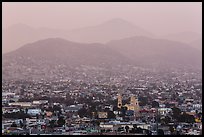 Distant view of Ensendada spreading up hills at sunset. Baja California, Mexico (color)