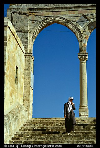 Muslim woman on stairs at the Dome of the Rock entrance. Jerusalem, Israel