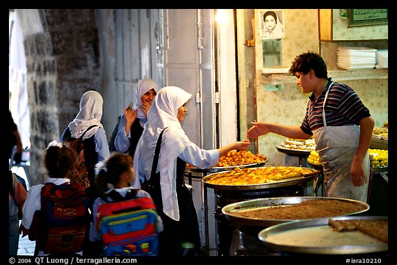 Muslem women purchasing sweets. Jerusalem, Israel (color)
