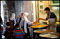 Muslem women purchasing sweets. Jerusalem, Israel (color)