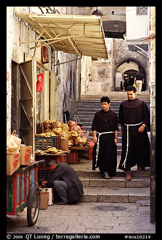 Two christian monks in a narrow alley. Jerusalem, Israel