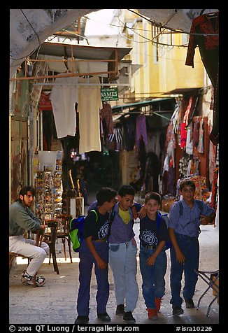 Children in a busy old town alley. Jerusalem, Israel (color)